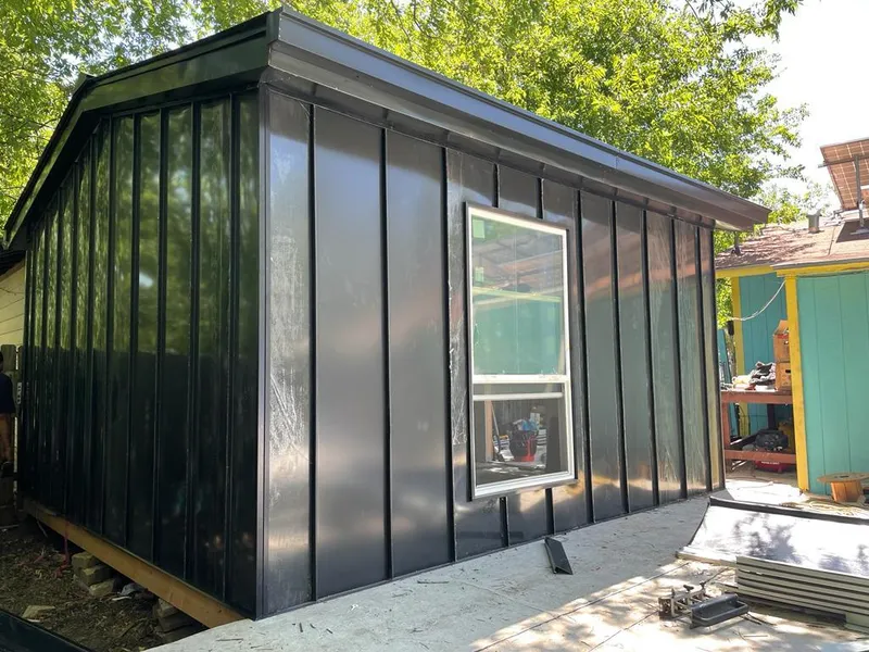 Black standing seam metal wall panels for Roof Inspection in Gateway